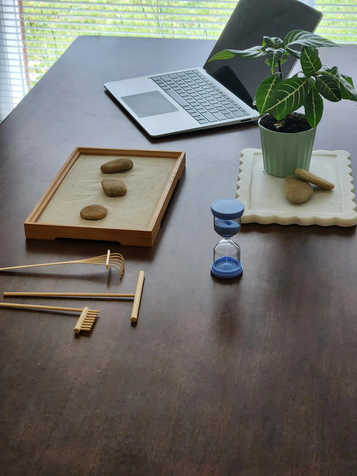 The Resetter zen sand garden: wooden sand tray with fine sand, five-piece wooden rake set, five-minute glass timer, natural stones and guide